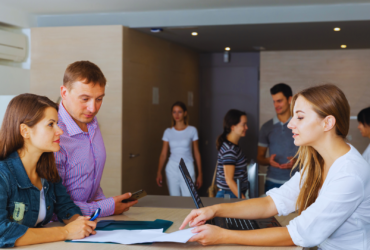 Modern office setting with IT professionals collaborating.